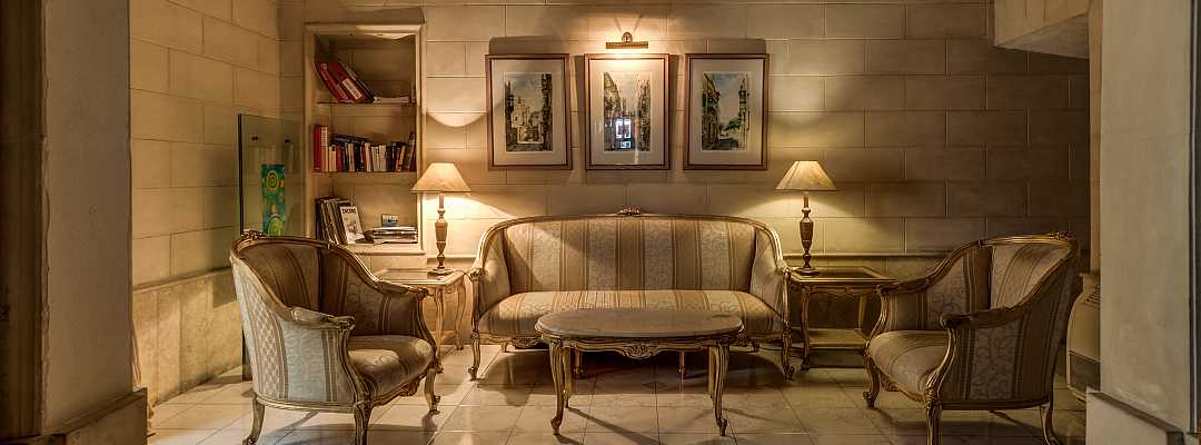 Elegant and welcoming sitting room at the entrance of Castille Hotel